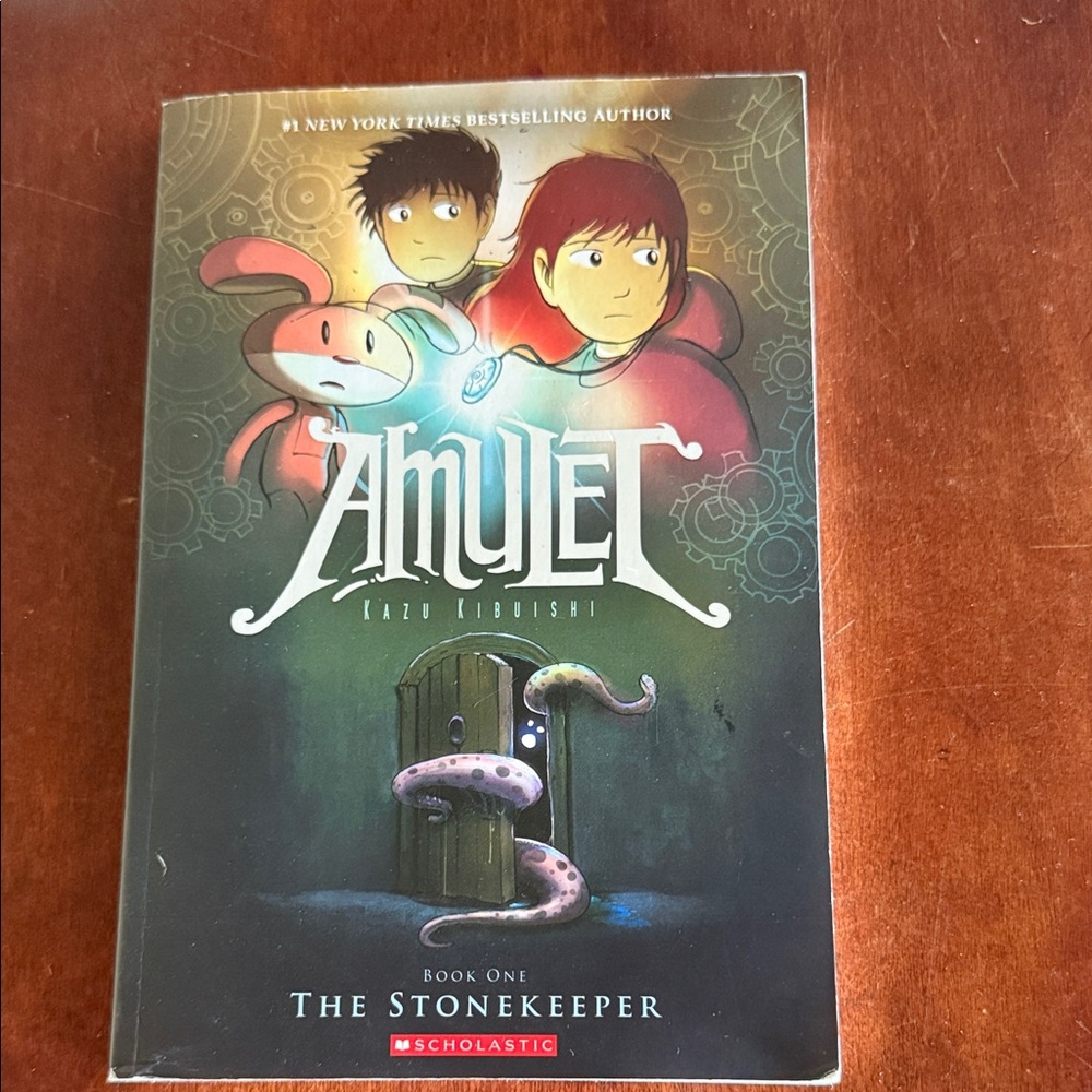 Scholastic Amulet Graphic Novel with Red and Green Cover